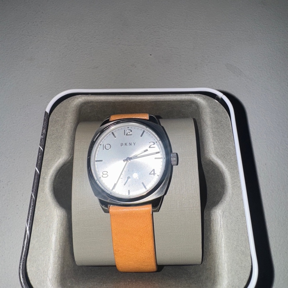 DKNY Timepiece with Silver Dial and Orange Band